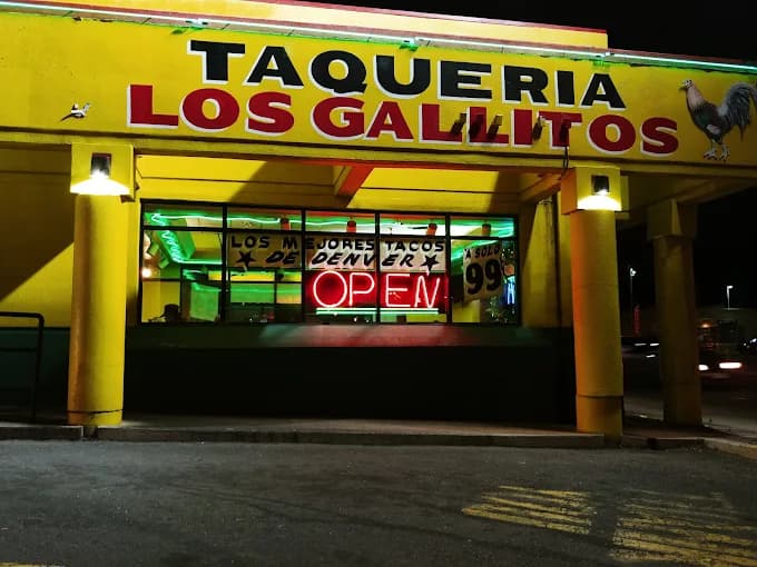 Taquería Los Gallitos storefront at night