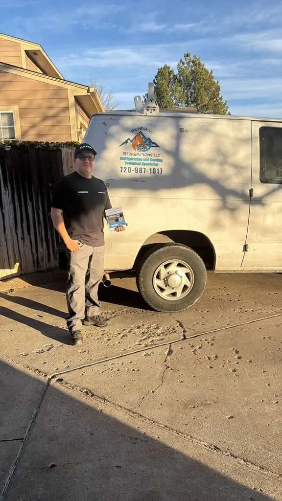 Friantartic technician beside the company van with the logo