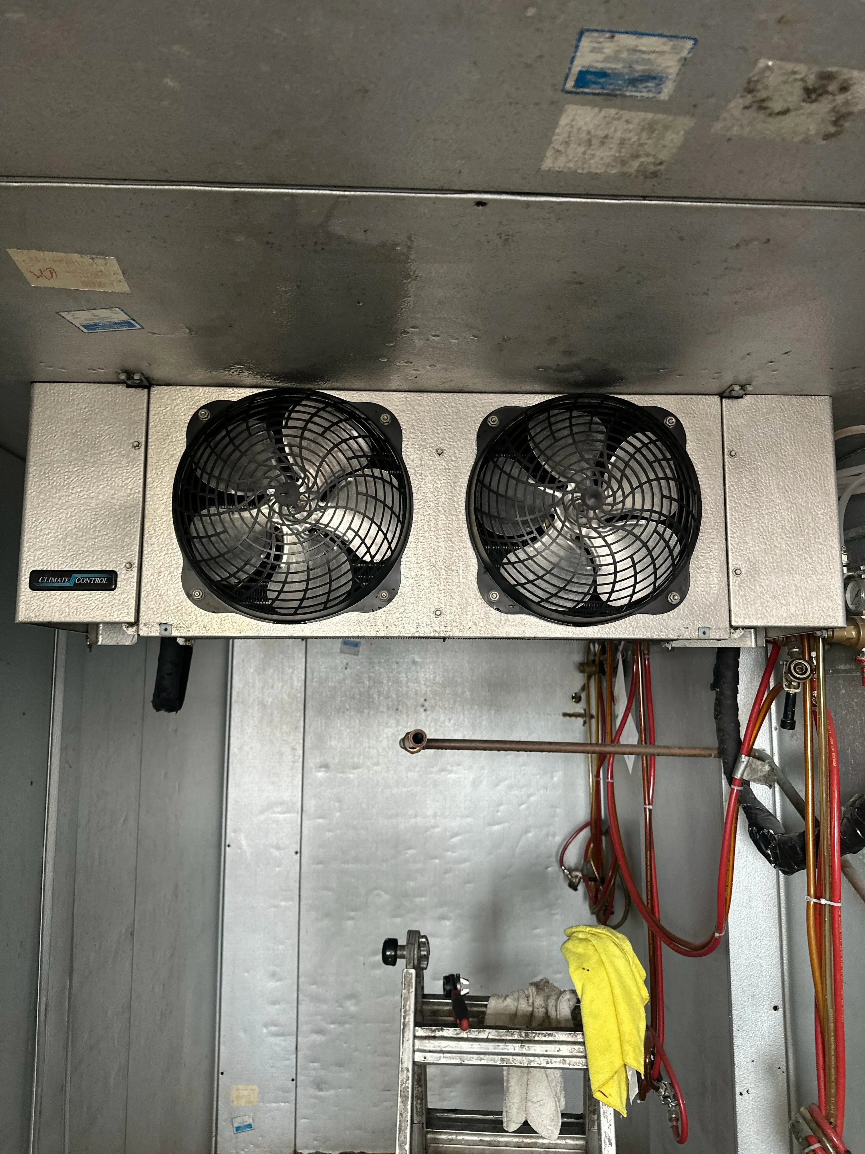 Evaporator fans mounted inside a walk-in cooler serviced by Friantartic